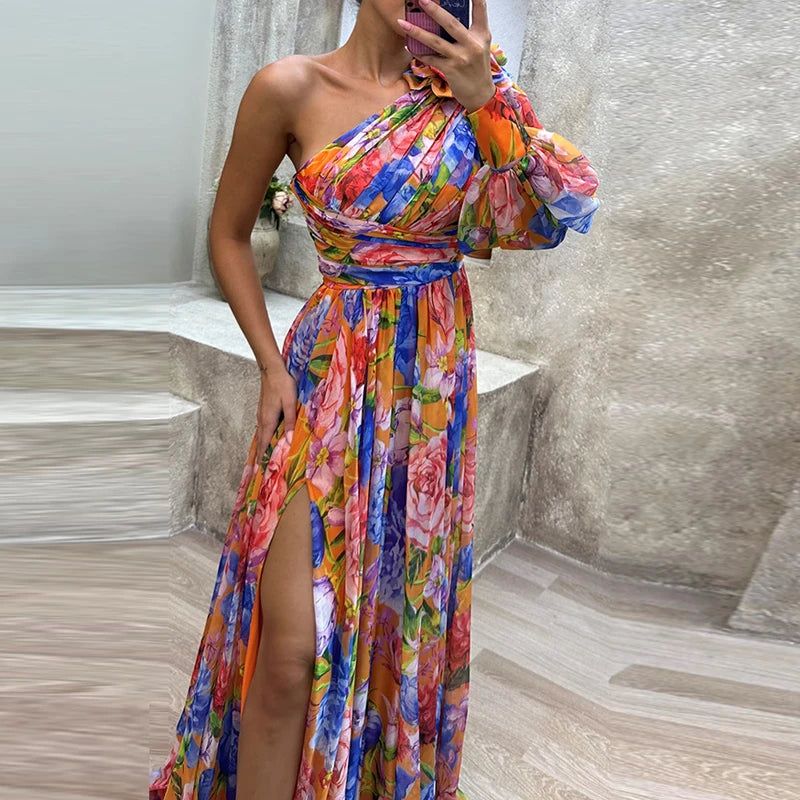 Mazarine | Robe Maxi Formelle Épaule Dégagée, Manches Bouffantes, Taille Cintrée, Fente sur Jambes, Motif Floral Multicolore